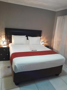 Ένα ή περισσότερα κρεβάτια σε δωμάτιο στο Three Way Inn