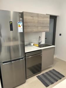 Η κουζίνα ή μικρή κουζίνα στο Sky serenity two rooms apartment
