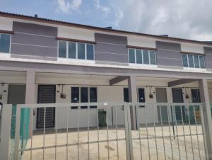 a building with a fence in front of it at Lilly Grove Homestay in Kampong Ayer Melintas Besar