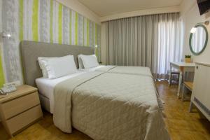 Postel nebo postele na pokoji v ubytování Hotel Pitsakis