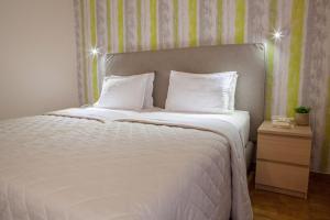 Postel nebo postele na pokoji v ubytování Hotel Pitsakis