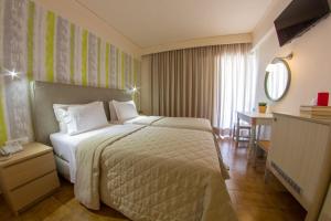 Postel nebo postele na pokoji v ubytování Hotel Pitsakis