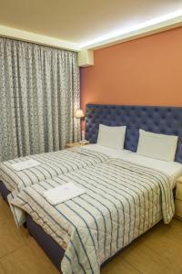 Postel nebo postele na pokoji v ubytování Hotel Pitsakis