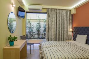 Postel nebo postele na pokoji v ubytování Hotel Pitsakis