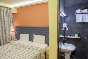 Postel nebo postele na pokoji v ubytování Hotel Pitsakis