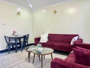 Posezení v ubytování Naka Executive Suites With Balcony, Amazing View of Lake Nakuru, GYM + 6 fotografií