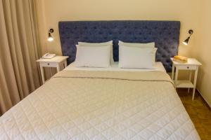 Postel nebo postele na pokoji v ubytování Hotel Pitsakis