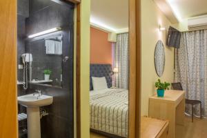 Postel nebo postele na pokoji v ubytování Hotel Pitsakis