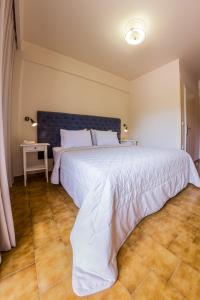 Postel nebo postele na pokoji v ubytování Hotel Pitsakis