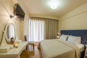 Postel nebo postele na pokoji v ubytování Hotel Pitsakis