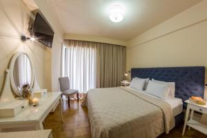 Postel nebo postele na pokoji v ubytování Hotel Pitsakis