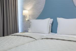 Postel nebo postele na pokoji v ubytování Hotel Pitsakis