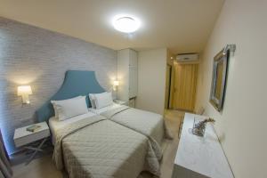 Postel nebo postele na pokoji v ubytování Hotel Pitsakis