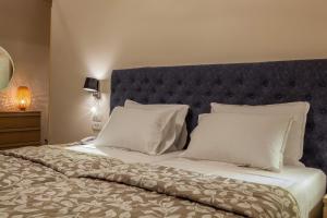 Postel nebo postele na pokoji v ubytování Hotel Pitsakis