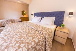 Postel nebo postele na pokoji v ubytování Hotel Pitsakis