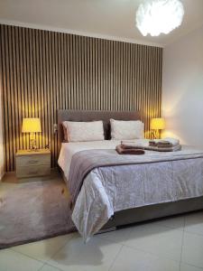 Posteľ alebo postele v izbe v ubytovaní Meteora Olio Hills apartment