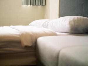 Katil atau katil-katil dalam bilik di 東海小時光 Tong Hai Time Homestay