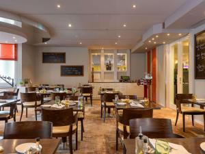 Um restaurante ou outro lugar para comer em Mövenpick Hotel Egerkingen