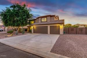 a house with a garage in front of a driveway at Blackfoot San Tan Valley in Queen Creek