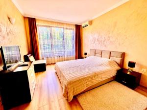 Ένα ή περισσότερα κρεβάτια σε δωμάτιο στο Sea Sun Holiday Apartments