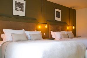 Voodi või voodid majutusasutuse Fiddle + Bow Hotel toas