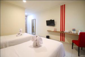 Kama o mga kama sa kuwarto sa Moritz Hotel RSAB Harapan Kita