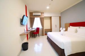 Kama o mga kama sa kuwarto sa Moritz Hotel RSAB Harapan Kita
