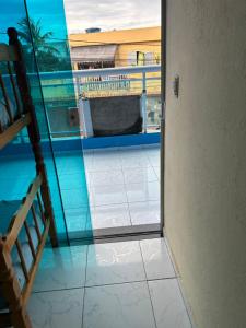 a view from the door of a room with a balcony at Romar Temporadas in Cabo Frio