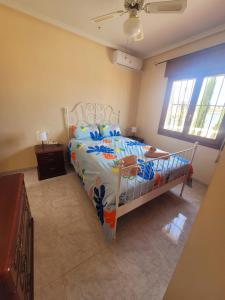 a bedroom with a white bed in a room at casa des loups in Ciudad Quesada +25 photos