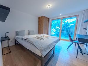 Postel nebo postele na pokoji v ubytování Koller Sapuen by Arosa Holiday + 16 fotografií