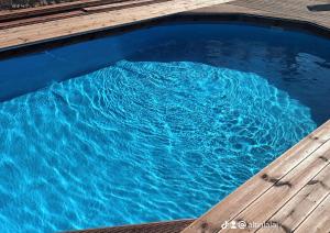 an overhead view of a pool of blue water at Panorama in Elafonisi