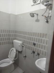 a bathroom with a toilet and a sink at Hotel Abhi family guest house in Lucknow