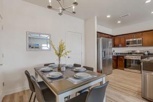 a kitchen and dining room with a table and chairs at Bliss Flagstaff 49 in Bellemont
