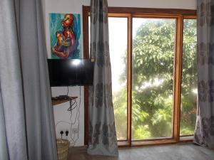 TV a/nebo společenská místnost v ubytování Boutique Ocean View Nungwi