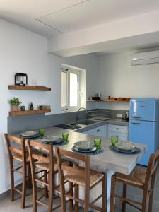 Kuchyň nebo kuchyňský kout v ubytování Kyma - Villas