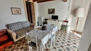 a living room with a couch and a table at Casa Carmela a Presicce in Presicce