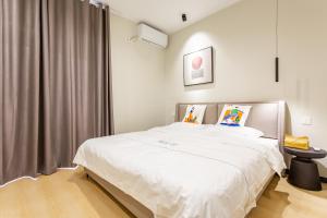 Postel nebo postele na pokoji v ubytování Gu'an County Qiaofei Homestay + 9 fotografií