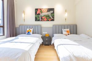 Postel nebo postele na pokoji v ubytování Gu'an County Qiaofei Homestay