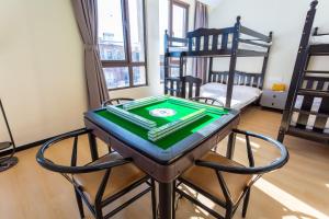 Postel nebo postele na pokoji v ubytování Gu'an County Qiaofei Homestay