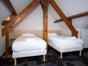 Postel nebo postele na pokoji v ubytování ibis Styles Honfleur Centre Historique