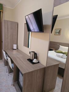 Postel nebo postele na pokoji v ubytování Hotel Romano
