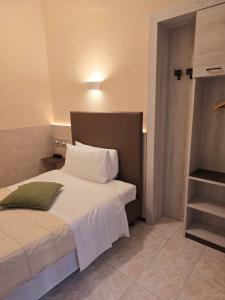 Postel nebo postele na pokoji v ubytování Hotel Romano