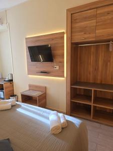 Postel nebo postele na pokoji v ubytování Hotel Romano