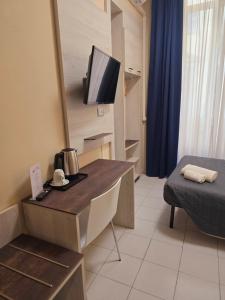 TV a/nebo společenská místnost v ubytování Hotel Romano