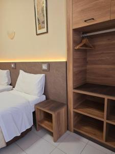 Postel nebo postele na pokoji v ubytování Hotel Romano