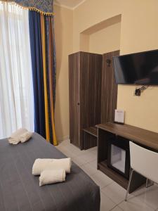 Postel nebo postele na pokoji v ubytování Hotel Romano