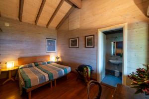 A bed or beds in a room at Agriturismo Natta Di Monte Tabor Még 37 kép