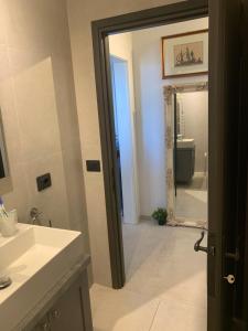 a bathroom with a sink and a mirror at Vinci Nice View in SantʼAnsano +61 photos