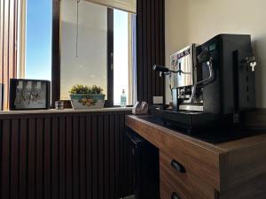 a coffee machine on a counter in a room at Re Vincy - Affittacamere in Bacoli