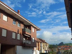 a brick building with a balcony on the side of it at Donnabellahome in Ajo